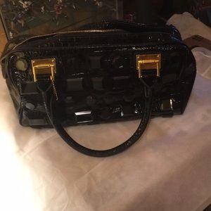 Black patent leather handbag